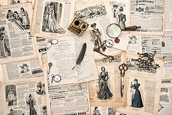 antique office accessories, writing tools, vintage fashion magazine for the woman from 1898. retro style toned picture
