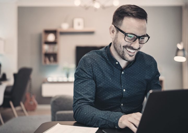 Businessman using laptop at home