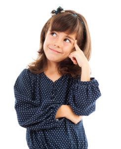 Closeup portrait of a cute little girl thinking isolated on white
