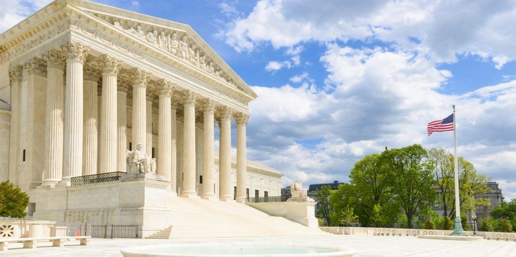 Supreme Court with flag 1060x529.jpg