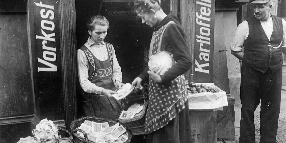 Vegetable seller during an economic crisis, Weimar Republic (Germany), circa 1919.  (Photo by Albert Harlingue/Roger Viollet via Getty Images)
