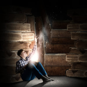 Teenager boy wearing jeans and shirt and reading book