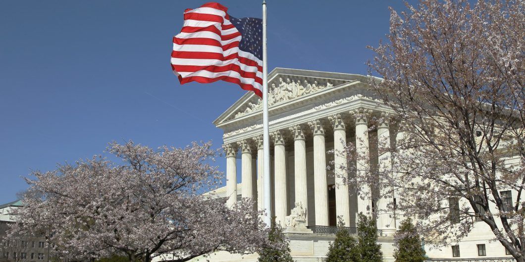 Supreme Court with flag 2 1060x530.jpg