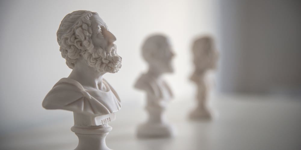 ATHENS, GREECE   FEBRUARY 6 2016: Little marble busts of ancient Greek authors on a white shelf