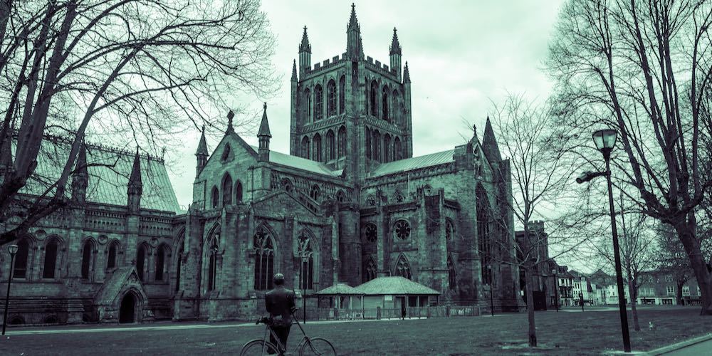 HEREFORD   19 APRIL 2015: Hereford Cathedral outside view with Sir Edward Elgar monument, England, UK
