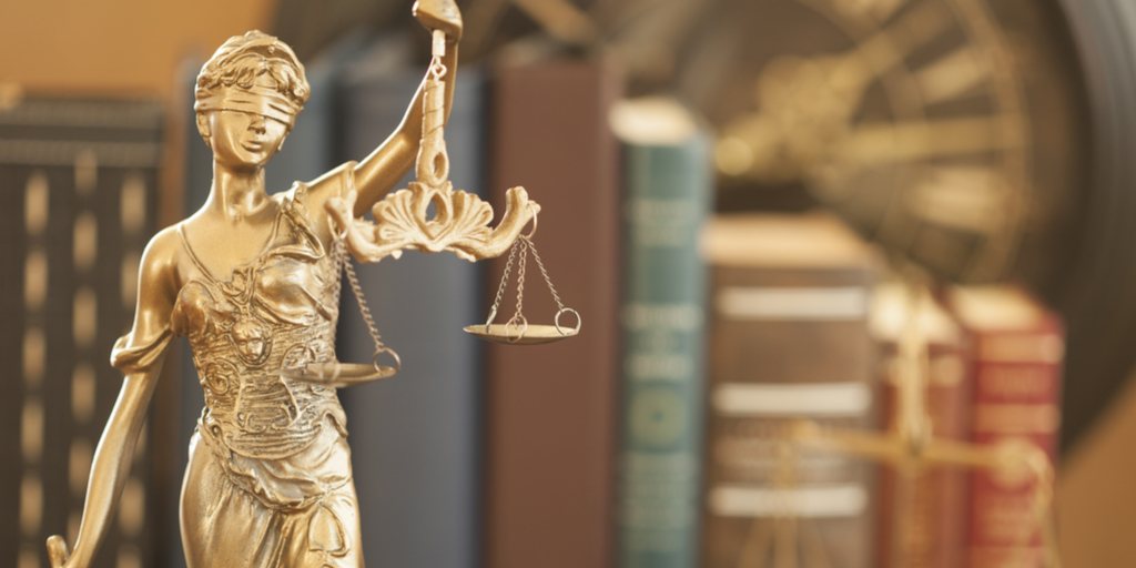 Justice up close books in background.jpg