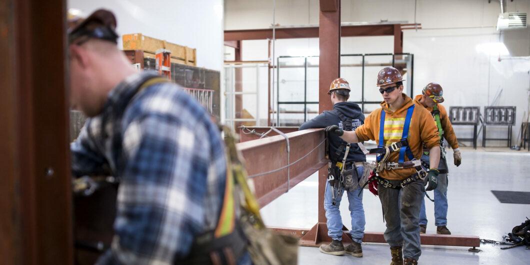 Garret Morgan (center) is training as an ironworker near Seattle and already has a job that pays him $50,000 a year.