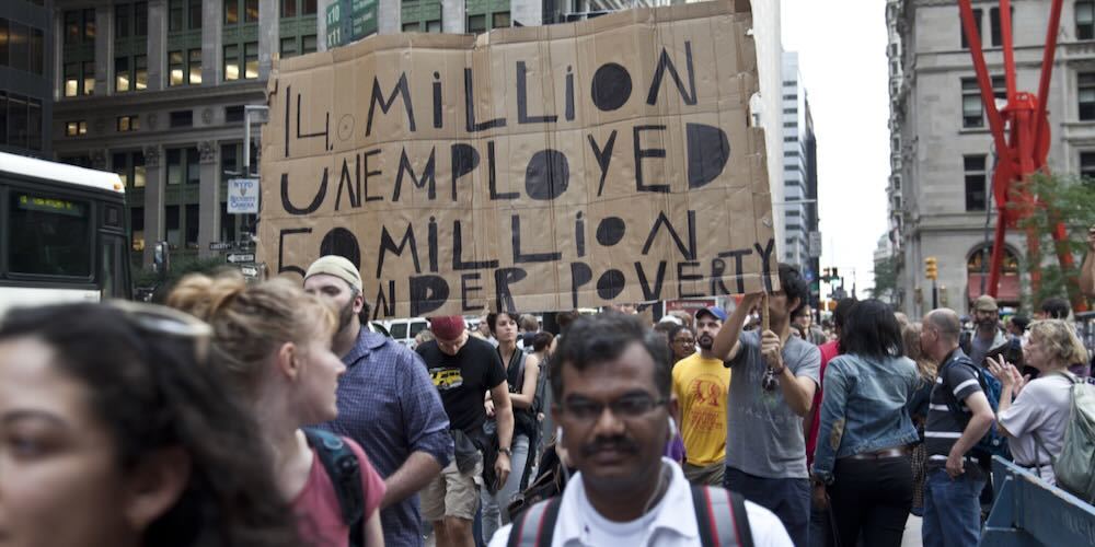 NEW YORK   SEPTEMBER 30: Unidentified demonstrators with 'Occupy Wall Street' march in Downtown Manhattan on September 30, 2011 in New York.