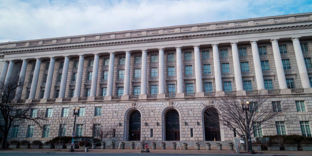 The IRS Building, headquarters of the Internal Revenue Service, in downtown Washington, D.C. seen from Constitution Avenue NW during a winter day. Low angle wide shot with no people visible.