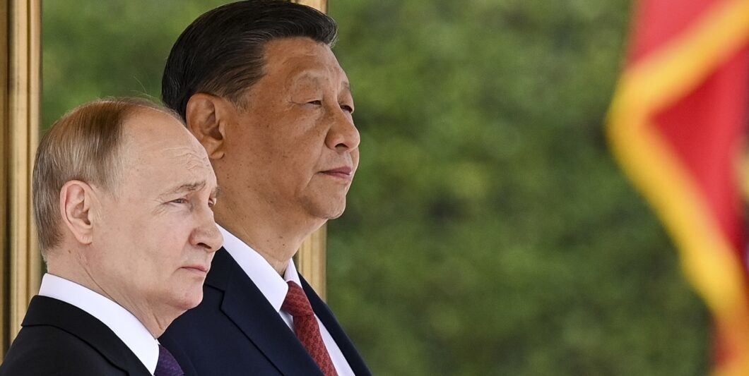 Chinese President Xi Jinping, right, and Russian President Vladimir Putin attend an official welcome ceremony in Beijing, China, on Thursday, May 16, 2024. (Sergei Bobylev, Sputnik, Kremlin Pool Photo via AP)