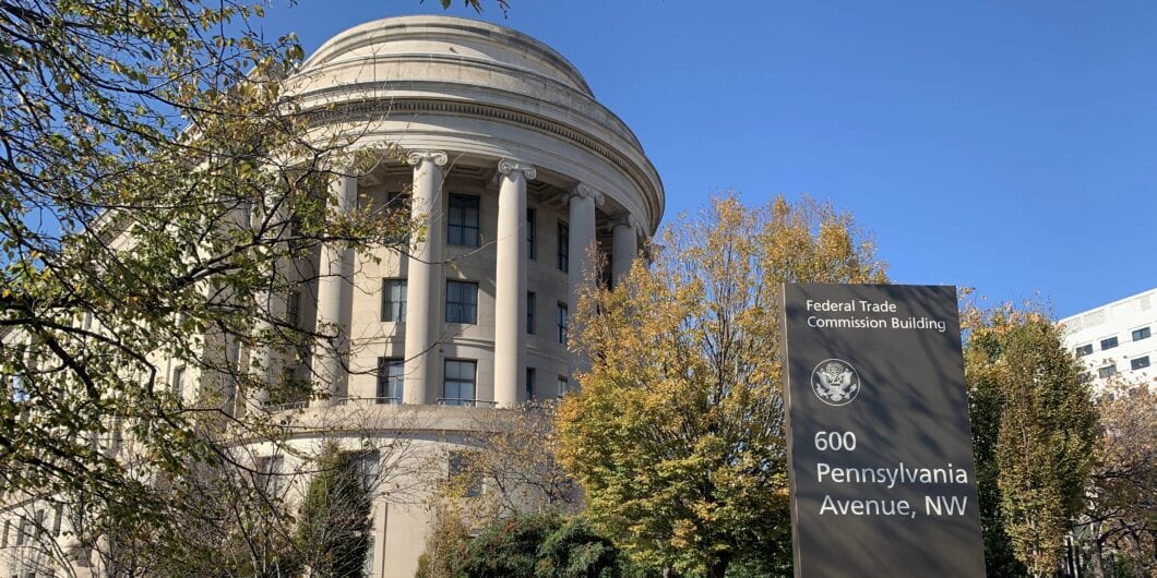 Washington, DC / US   November 06, 2019: Close view of the FTC Federal Trade Commission headquarters rotunda classical stone office building with the sign directory in the foreground