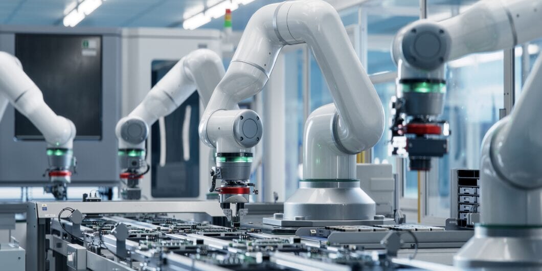 Advanced High Precision Robot Arm inside Bright Electronics Factory. Electronic Devices Production Industry. Component Installation on Circuit Board. Fully Automated Modern PCB Assembly Line.