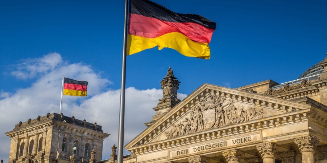 German flag at German Parliament shutterstock 526234636 1060x530.jpg