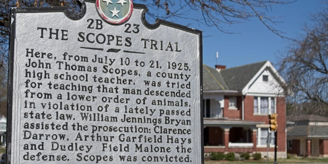 Dayton, Tennessee USA   03 21 2025   Scopes Trial historical sign in Dayton, Tennessee with brick house blurred on corner street