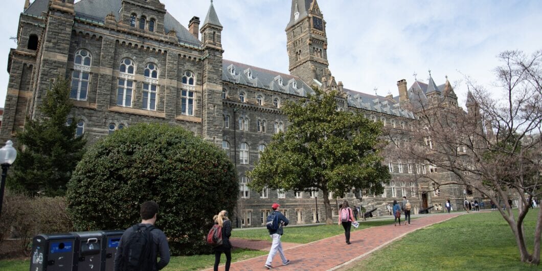 Students walking across the campus of Georgetown University.