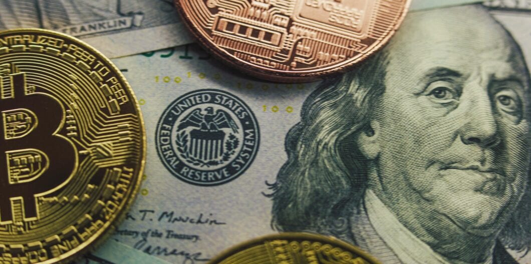 Golden bitcoin coins and hundred dollar bills with Benjamin Franklin portrait. Cryptocurrency and cash money. 100 USD bank notes and digital currency. Finance and investment concept. Extreme Close Up.